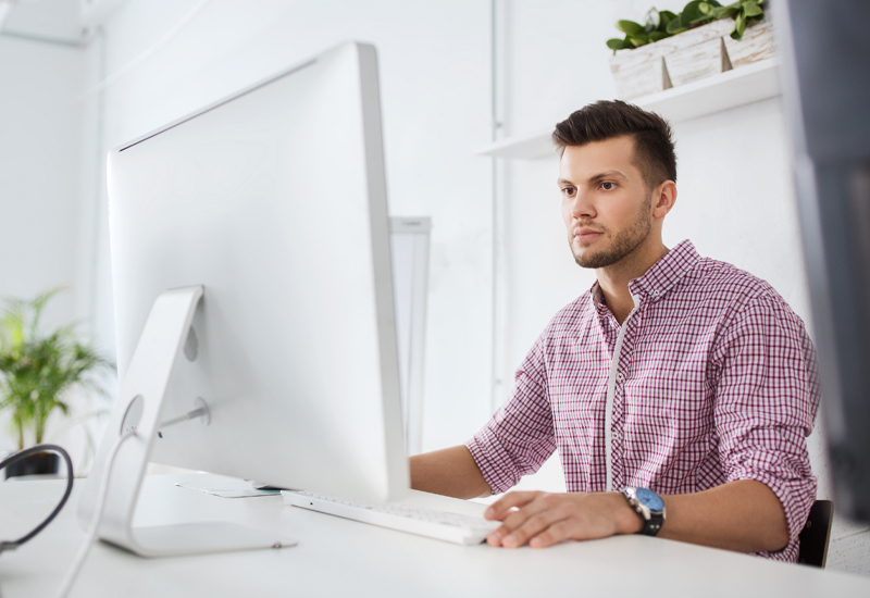 Engineer taking an online process safety eLearning course on a desktop computer.